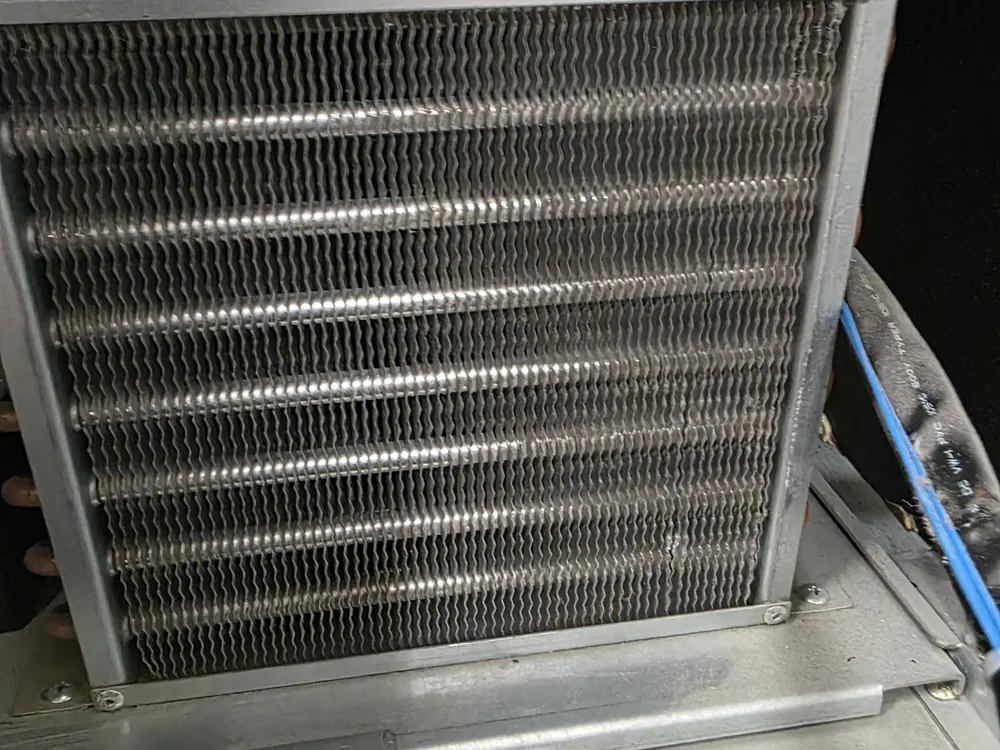 Clean AC condenser coil after professional cleaning in American Fork, Utah