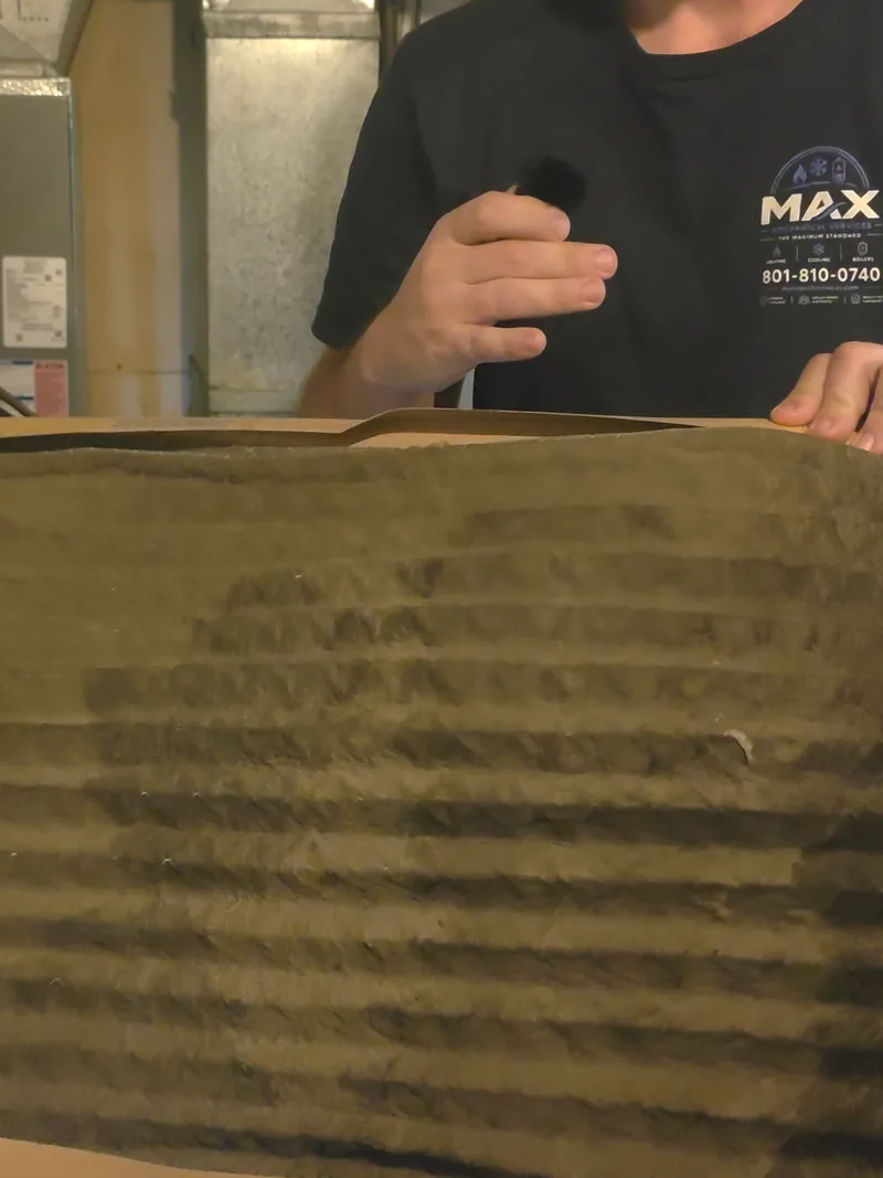 A clogged, dirty AC air filter pulled from a unit in Pleasant Grove, Utah