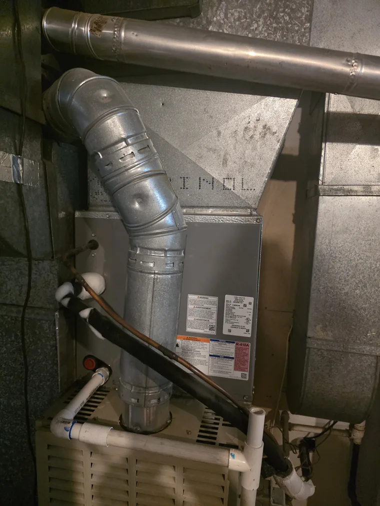 Frozen refrigerant suction line at a furnace air handler in Pleasant Grove, Utah — a sign it is time to call a technician
